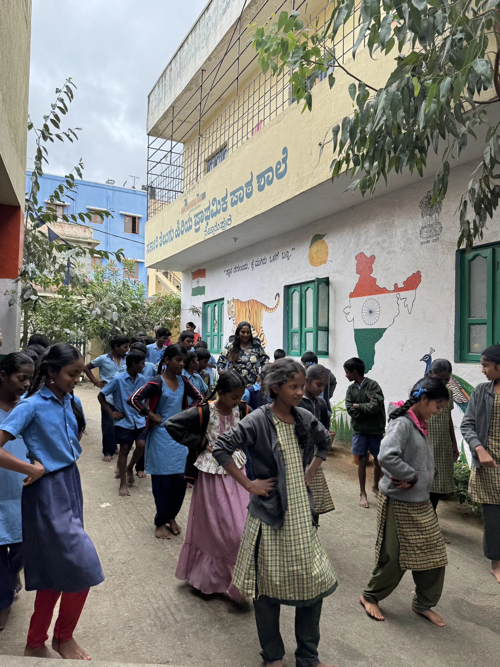 Students gathered in the courtyard of a government school during a SIFF visit