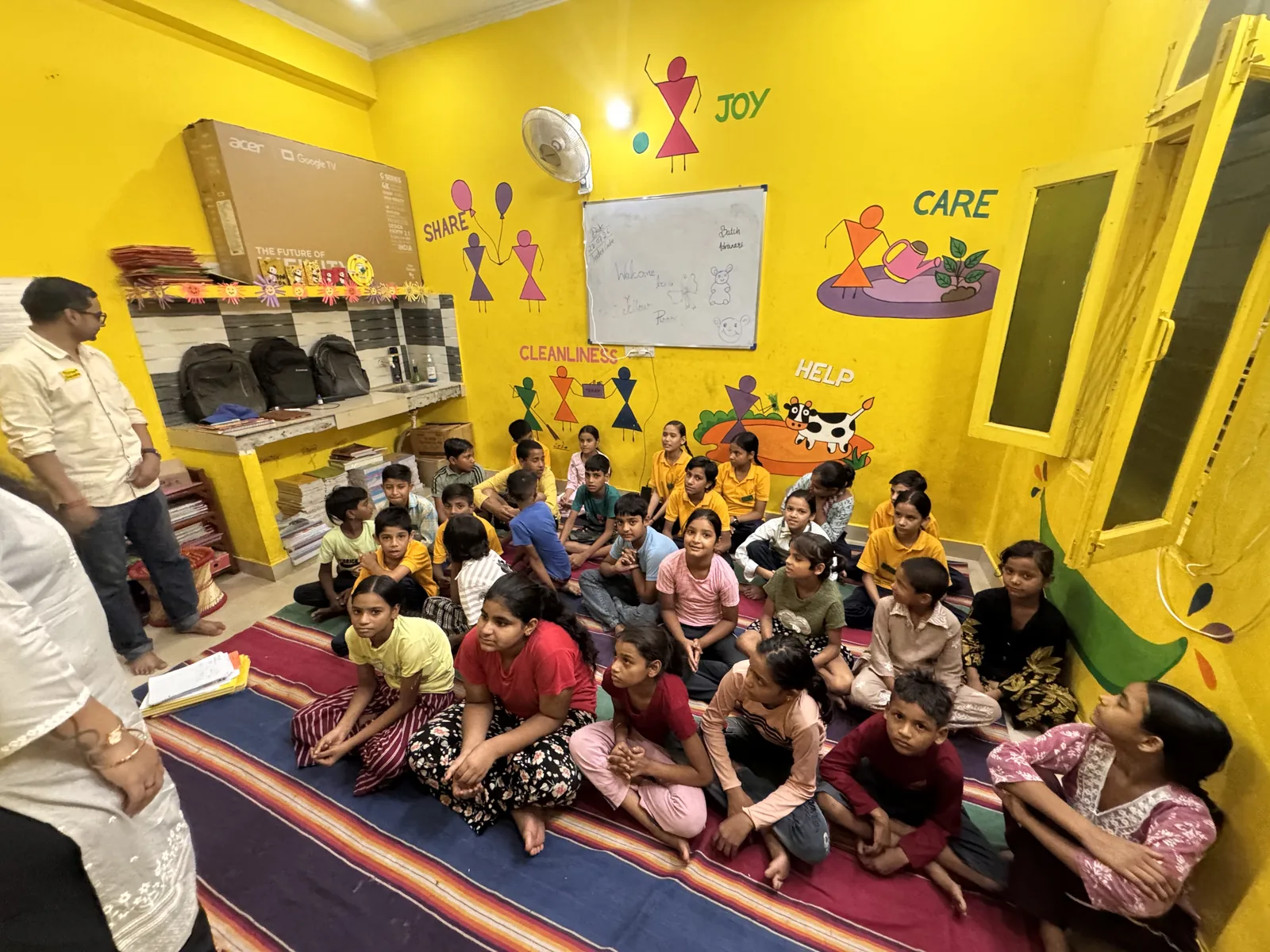 Children seated together in a bright classroom during a SIFF Young Artiste session